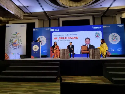 Stage screen announcing a special address by Guest of Honour Mr Siraj Hussain at Revolutionari